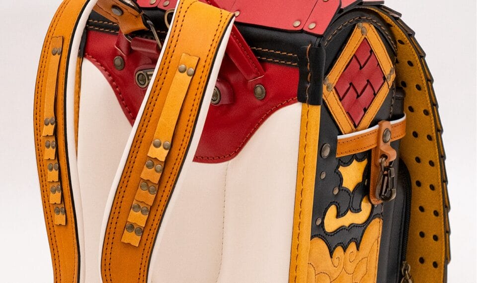 a detail of a backpack made from small strips of leather and brads to resemble samurai armor